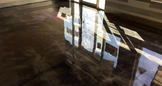 This image shows a restaurant with a brown epoxy flooring floor.