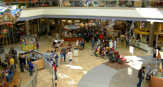 The image shows stores inside a mall.