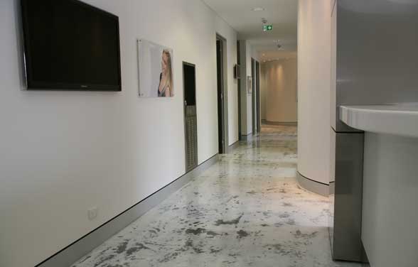 The image shows a commercial building with epoxy flooring.