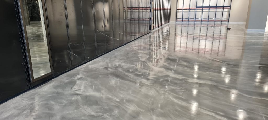 This image shows a metallic epoxy floor in an industrial plant.