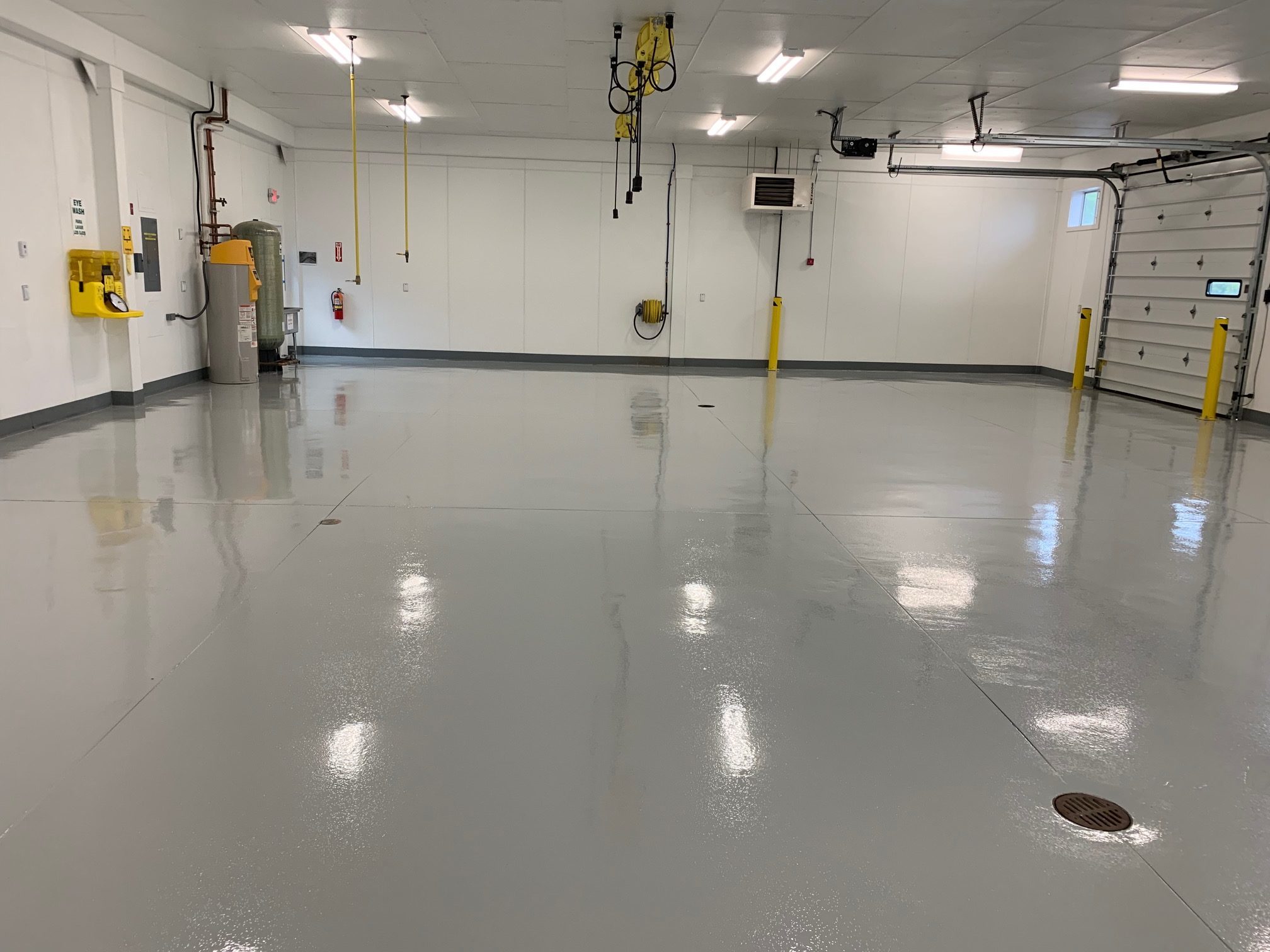 This image shows a garage with grey epoxy floor.